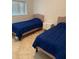 This bedroom offers two beds, neutral tones, and ample natural light at 845 S Gulfview Blvd # 110, Clearwater Beach, FL 33767