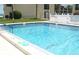 Clear community pool with visible depth markers and pool rules posted nearby at 845 S Gulfview Blvd # 110, Clearwater Beach, FL 33767