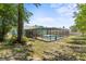 A spacious backyard features a screened-in pool and patio area, perfect for entertaining at 10512 Red Coach St, Spring Hill, FL 34608