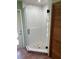 Bathroom with modern glass shower and sleek black hardware at 10512 Red Coach St, Spring Hill, FL 34608