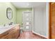 Bathroom with double sink vanity and tiled shower at 10512 Red Coach St, Spring Hill, FL 34608