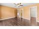Bedroom featuring hardwood flooring and multiple doors at 10512 Red Coach St, Spring Hill, FL 34608