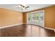 Bedroom featuring hardwood flooring and a large bay window at 10512 Red Coach St, Spring Hill, FL 34608