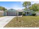 Charming single-story home with a well-maintained lawn and attached garage, offering great curb appeal at 10512 Red Coach St, Spring Hill, FL 34608
