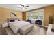 Comfortable main bedroom with plush carpeting, large bay window and cozy furniture at 10512 Red Coach St, Spring Hill, FL 34608