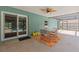 Covered patio area with pool view, furniture set, and decorative touches at 10512 Red Coach St, Spring Hill, FL 34608