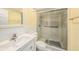 Bathroom featuring a glass-enclosed shower, toilet and sink at 1179 Lazy Lake W Rd, Dunedin, FL 34698