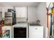 Utility room with a new washer and dryer, and stainless steel refrigerator at 1179 Lazy Lake W Rd, Dunedin, FL 34698