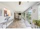 Spacious dining area featuring dining table and chairs, and an outdoor patio at 1179 Lazy Lake W Rd, Dunedin, FL 34698