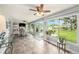 Spacious dining area featuring dining table and chairs, and an outdoor patio at 1179 Lazy Lake W Rd, Dunedin, FL 34698