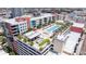 Aerial view of a modern apartment complex, showcasing a pool, cabanas, and lush landscaping, perfect for relaxation at 1208 E Kennedy Blvd # 831, Tampa, FL 33602
