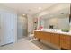 Bright bathroom featuring a double vanity, modern fixtures, and a tiled shower at 1208 E Kennedy Blvd # 831, Tampa, FL 33602