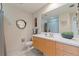 Bathroom showcasing the vanity, mirror, toilet, and shower with a modern aesthetic at 1208 E Kennedy Blvd # 831, Tampa, FL 33602