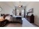 Comfortable bedroom with large bed, wooden furniture, ceiling fan and natural light at 1208 E Kennedy Blvd # 831, Tampa, FL 33602