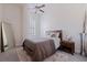 Bright bedroom featuring a queen-size bed, area rug, full length mirror, and modern decor at 1208 E Kennedy Blvd # 831, Tampa, FL 33602