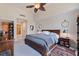 Comfortable bedroom with a large bed, hardwood nightstands and closet access at 1208 E Kennedy Blvd # 831, Tampa, FL 33602