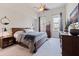 Comfortable bedroom with large bed, wooden furniture, ceiling fan and natural light at 1208 E Kennedy Blvd # 831, Tampa, FL 33602