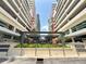 Grand Central at Kennedy entrance showcases a modern building with lush landscaping at 1208 E Kennedy Blvd # 831, Tampa, FL 33602