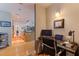 Home office setup with desk, computer, and shelving in a light-filled space at 1208 E Kennedy Blvd # 831, Tampa, FL 33602