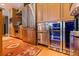 Kitchen appliances with stainless steel refrigerator, wine cooler, and custom wood cabinets at 1208 E Kennedy Blvd # 831, Tampa, FL 33602