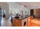 Open floor plan with kitchen island and view of the living room at 1208 E Kennedy Blvd # 831, Tampa, FL 33602