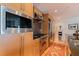 Kitchen with stainless steel appliances and wooden cabinetry at 1208 E Kennedy Blvd # 831, Tampa, FL 33602