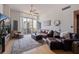 Cozy living room with hardwood floors, a plush rug, and ample natural light at 1208 E Kennedy Blvd # 831, Tampa, FL 33602