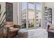 Bright living room with large windows, comfortable seating, and serene outdoor view at 1208 E Kennedy Blvd # 831, Tampa, FL 33602