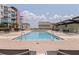 Resort-style community pool with chairs for lounging at 1208 E Kennedy Blvd # 831, Tampa, FL 33602
