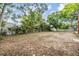 Large, fenced backyard offers plenty of space for outdoor activities and potential landscaping projects at 1225 15Th St, Palm Harbor, FL 34683