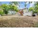 Spacious backyard featuring a deck, a storage shed, and room for a garden at 1225 15Th St, Palm Harbor, FL 34683