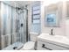 Modern bathroom with glass shower and contemporary fixtures at 1225 15Th St, Palm Harbor, FL 34683