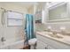 Bathroom featuring vanity with marble counter, bathtub and shower at 1225 15Th St, Palm Harbor, FL 34683