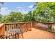 Charming outdoor deck space with wood railings, table and chairs, perfect for relaxing and enjoying the view at 1225 15Th St, Palm Harbor, FL 34683