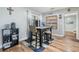 Cozy dining area with wood-style floors, a breakfast table set, and sliding glass doors for outdoor access at 1225 15Th St, Palm Harbor, FL 34683