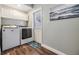 Laundry room featuring washer, dryer, and plenty of cabinet storage at 1225 15Th St, Palm Harbor, FL 34683