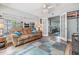 Cozy living room with lots of natural light, wood-style flooring, and comfortable seating arrangements at 1225 15Th St, Palm Harbor, FL 34683