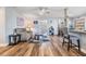 Inviting living room featuring wood-style floors, a comfortable seating area, and an open layout at 1225 15Th St, Palm Harbor, FL 34683
