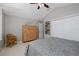 Bedroom with a wooden dresser, double closets and a relaxing ambiance, perfect for rest and rejuvenation at 1228 Dartford Dr, Tarpon Springs, FL 34688