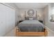 Comfortable bedroom with a wooden bed frame, soft lighting, and ample closet space, offering a peaceful retreat at 1228 Dartford Dr, Tarpon Springs, FL 34688