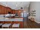 Gourmet kitchen featuring granite counters, stainless steel appliances, and hardwood floors at 1228 Dartford Dr, Tarpon Springs, FL 34688