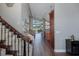 View from the stairwell of an open concept living room with hardwood floors at 1228 Dartford Dr, Tarpon Springs, FL 34688