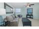Stylish living room with a comfortable sofa, accent chair, and a modern coffee table, ideal for relaxation and entertainment at 1228 Dartford Dr, Tarpon Springs, FL 34688