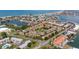 A high-angle perspective displays an inviting residential community with boat docks and beautiful waterfront views nearby at 12321 Sun Vista W Ct # 52, Treasure Island, FL 33706