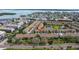 This aerial showcases the beautiful townhome community near the water at 12321 Sun Vista W Ct # 52, Treasure Island, FL 33706