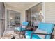 Cozy balcony featuring comfortable seating and sliding glass doors leading to the living area at 12321 Sun Vista W Ct # 52, Treasure Island, FL 33706