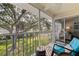 Charming screened balcony offers a relaxing outdoor space with views of lush landscaping at 12321 Sun Vista W Ct # 52, Treasure Island, FL 33706