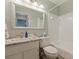 Bathroom featuring a granite countertop, white vanity, tub-shower combo with neutral paint that creates a serene atmosphere at 12321 Sun Vista W Ct # 52, Treasure Island, FL 33706