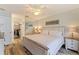 Serene bedroom featuring a mirrored closet, neutral color palette, and modern furnishings at 12321 Sun Vista W Ct # 52, Treasure Island, FL 33706
