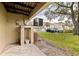 Exterior view of the property with an AC unit, featuring well-maintained landscaping and community views at 12321 Sun Vista W Ct # 52, Treasure Island, FL 33706